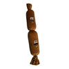A brown squeaky dog chew toy shaped like a dog, featuring cartoon eyes and a mustache.