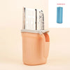 A stainless steel cat litter shovel with a refill bag is shown in a peach-colored container.