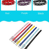 Three leather dog collars in red purple and black with metal rivets displayed side by side.