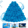 A pile of blue reusable pool filter balls with water splashing around them.