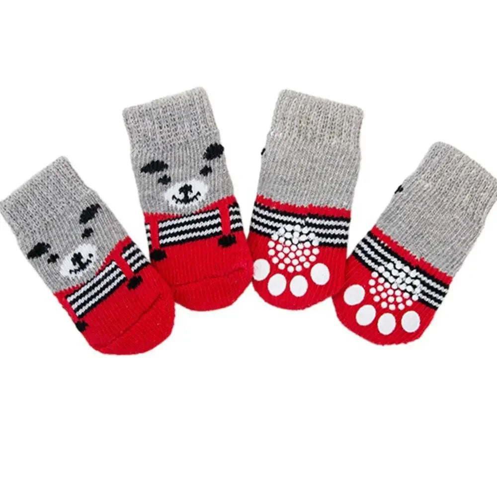 A pack of four anti-slip pet socks for dogs and cats featuring gray and red patterns.