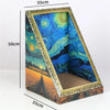 A rectangular cat bed featuring a vibrant starry night sky design with a golden frame and a textured insert.