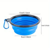 A bright blue portable silicone dog travel bowl with a black rim and a loop for carrying.