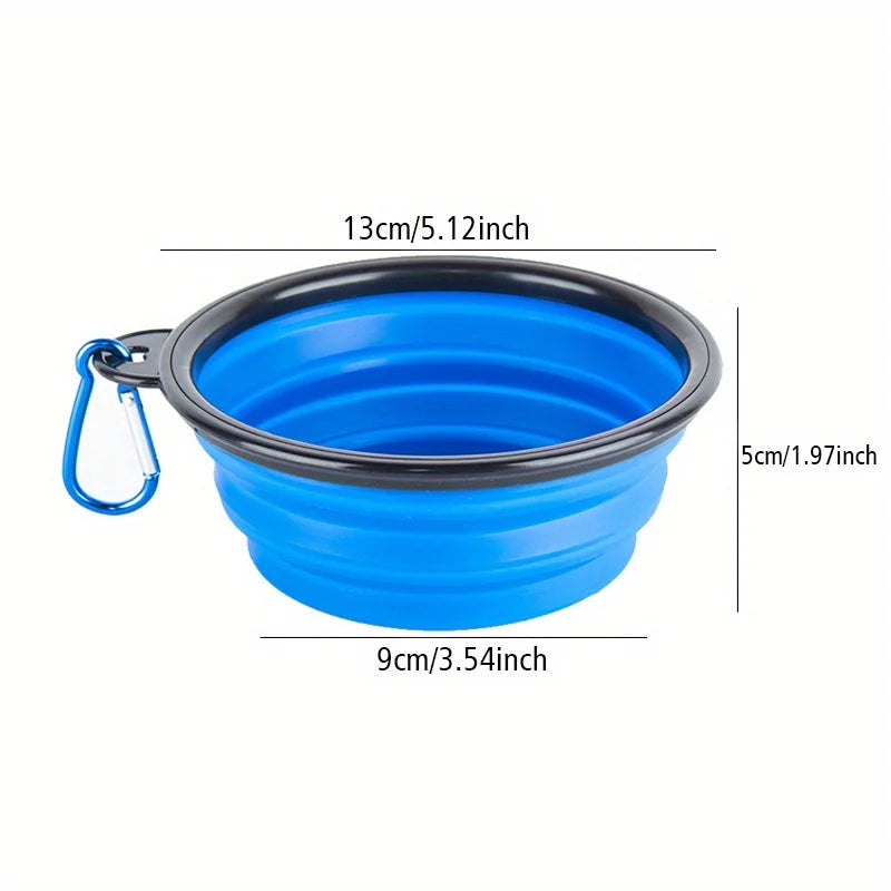 A bright blue portable silicone dog travel bowl with a black rim and a loop for carrying.