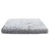 A rectangular, gray ultra plush orthopedic dog bed with a fluffy texture.