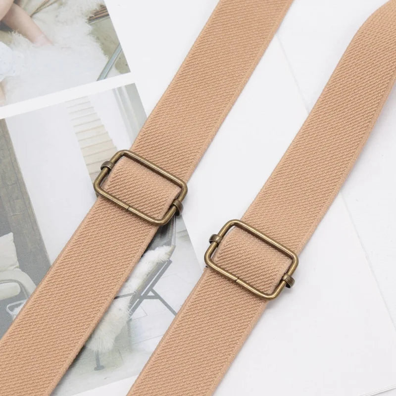 Tan adjustable clip-on suspenders for kids shown against a white background.