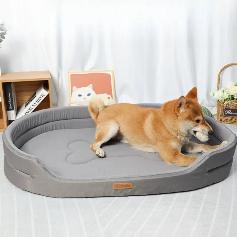A light brown dog is lying on a gray washable waterproof dog bed mat.