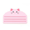 A pink reusable cat food pouch scraper shaped like a cat's head.