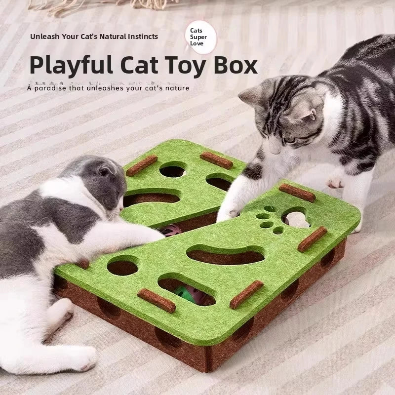 A playful cat toy box with various puzzle elements and a cat playing on it.