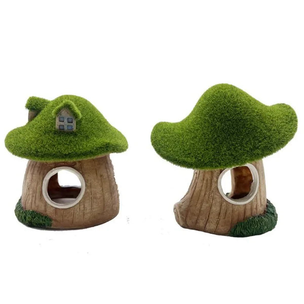 A miniature resin aquarium house decor featuring a green mossy tree shelter for small fish and shrimp.