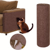 A brown tabby cat sits on a rectangular, textured scratching mat next to a cylindrical roll of the same material.