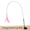 A long black suction cup wand with a pink feather attached, used as a cat teaser toy.