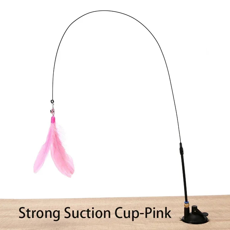 A long black suction cup wand with a pink feather attached, used as a cat teaser toy.