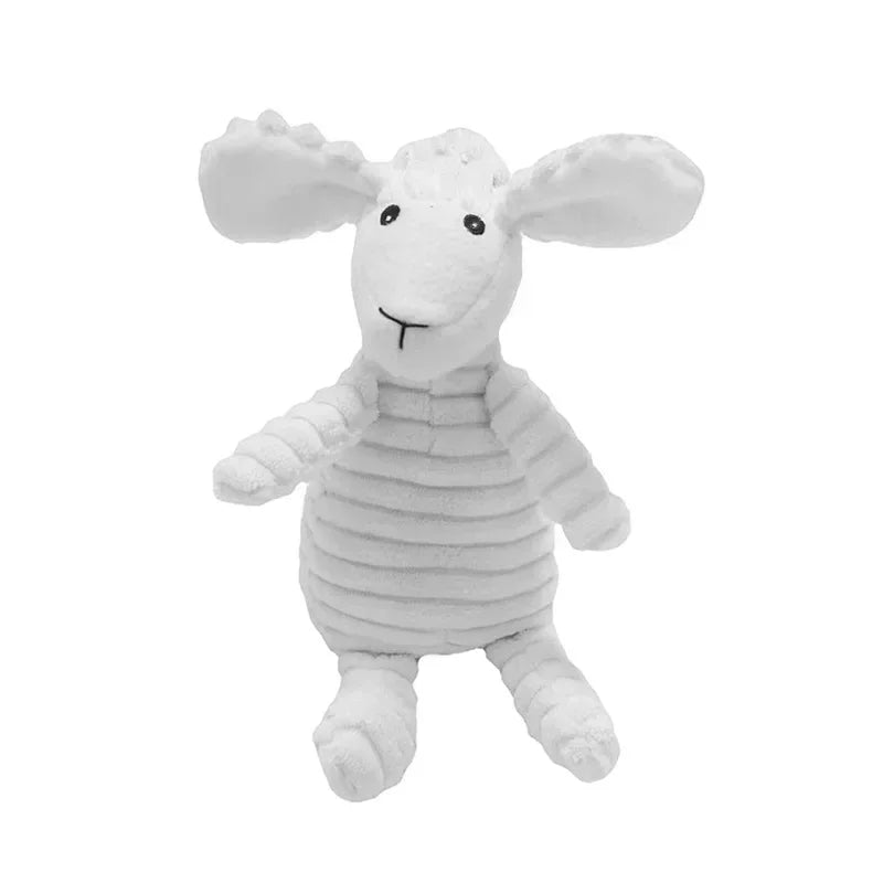 A white stuffed animal resembling a lamb or goat with floppy ears and a corduroy body.