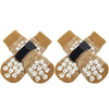 Pair of tan and white anti-slip dog socks with traction straps