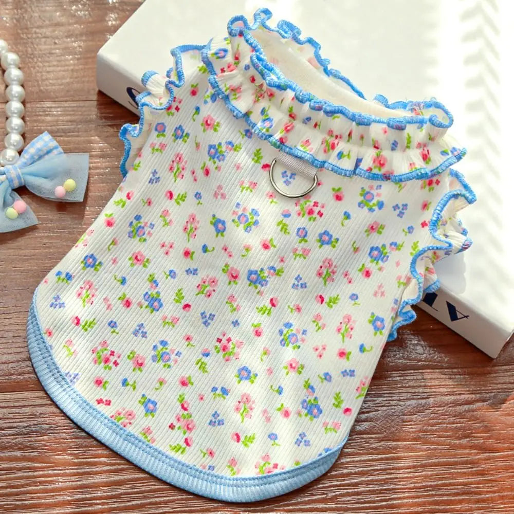 A light blue floral princess pet dress for dogs and cats with ruffled trim
