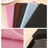A collection of pink, black, and light blue double-layer cat litter mats showing various textures and angles.