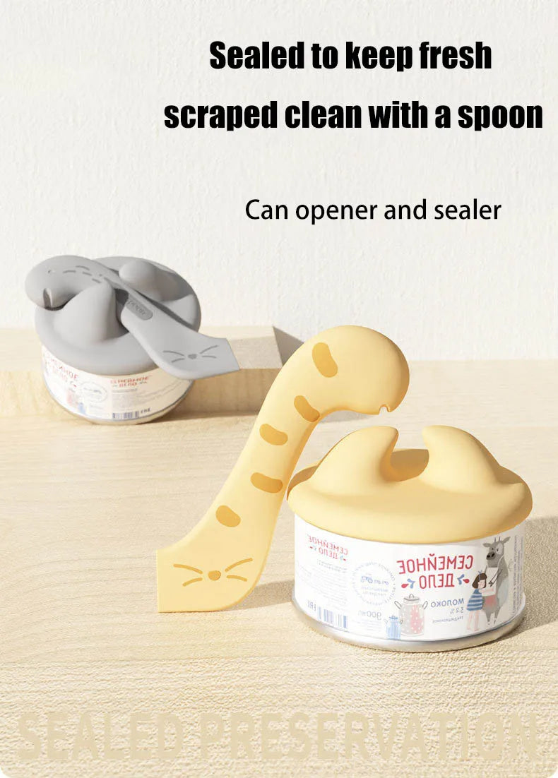 Yellow silicone pet can opener and feeding spoon with a sealing lid shown next to its container.