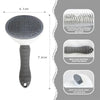 A gray pet hair remover grooming brush with a silicone handle and a stainless steel needle for cleaning hair.