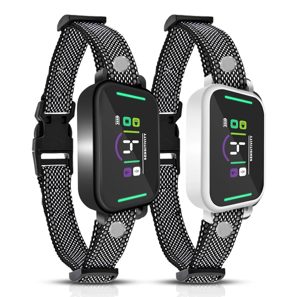 A pair of black and white adjustable dog bark collars with digital displays and vibration features.