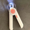 A white professional pet nail clipper with an LED light feature, shown from the side.