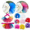 A collection of colorful tulle tutu dresses for small dogs, including blue, pink, yellow, and purple options.