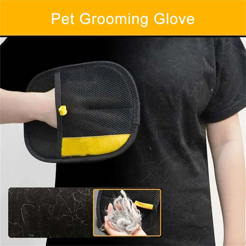 A hand is using a black pet grooming glove to remove hair from a pet's fur.