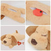 A soft, tan plush comfort toy shaped like a dog's head with an attached red heart detail.