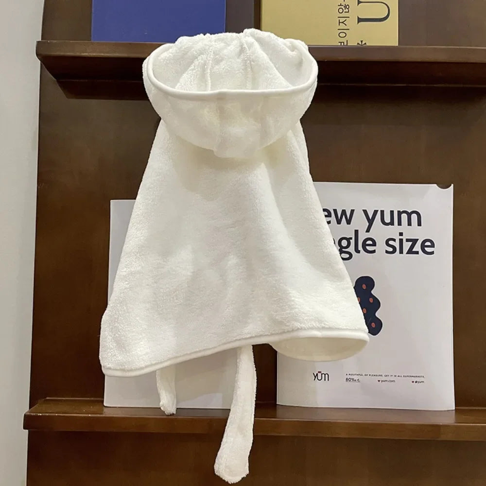 A white multi-purpose pet bath robe for dogs is displayed on a wooden shelf.