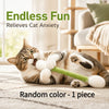 A tabby cat is playing with a green interactive wand toy on a light-colored rug.