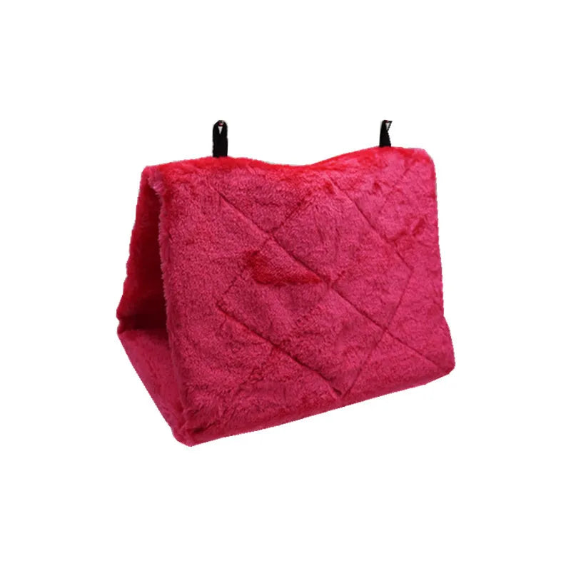 A magenta plush bird hammock tent with a quilted pattern.