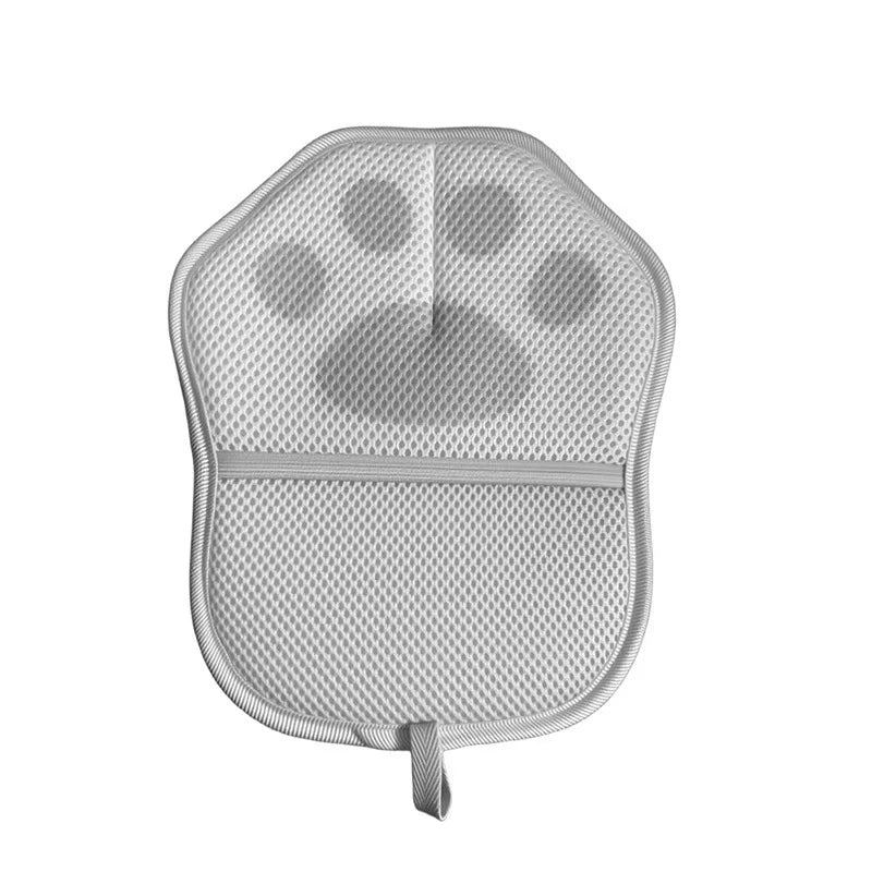 A gray reusable electrostatic pet hair remover glove with a padded palm and a flexible strap.