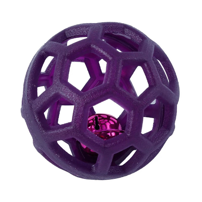 A purple natural rubber interactive dog chew ball with a bell, viewed from above.