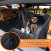 A black hammock style dog car seat cover installed in the rear of a vehicle, featuring anti-slip zippers.