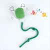 A green training ball with a string attached, used for automatic cat and dog training.