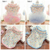 Four styles of floral princess pet dresses for dogs and cats shown in different colors and designs