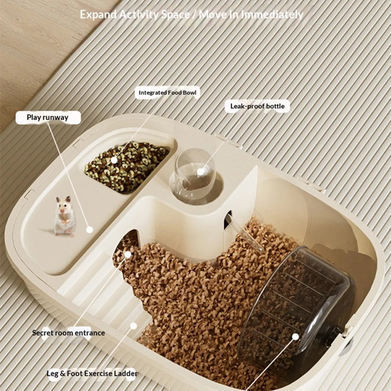 A luxury hamster habitat cage showing an expanded activity space with a food bowl, water bottle, play run, and a feed area.