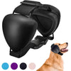 Black noise reducing dog ear muffs worn by a golden retriever.