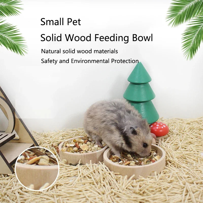 A small gray pet is eating from a natural solid wood feeding bowl on a light-colored surface.