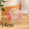 A clear plastic ball with pink accents used for hamster exercise and play.
