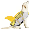 A light-colored dog wearing a yellow and gray swimming life jacket for water activities.
