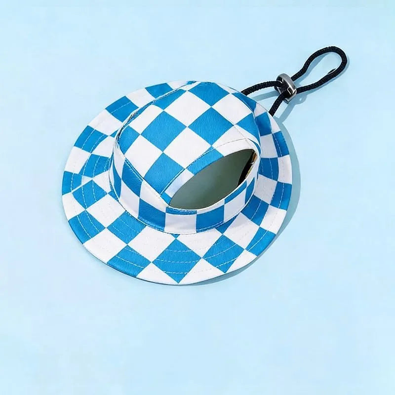 A blue and white checkered bucket hat with a black strap is shown against a light blue background.