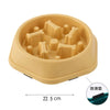 A light beige anti-choking slow feeder dog bowl with a puzzle design for feeding.