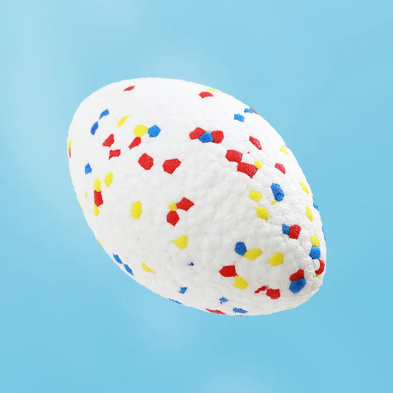 A white, textured chew ball speckled with multi-colored confetti for dogs