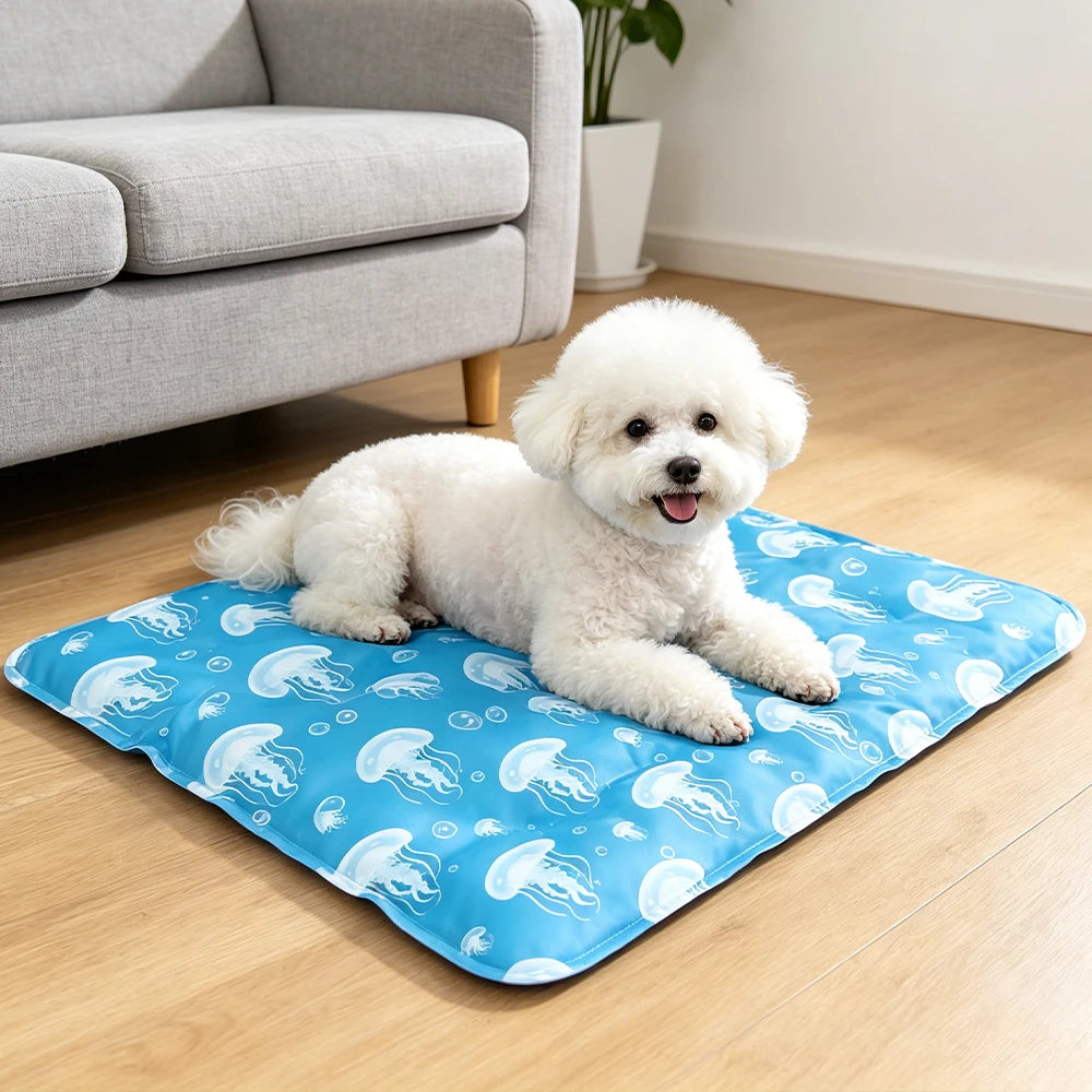 A fluffy white dog lying on a blue pet mat decorated with underwater sea creatures.