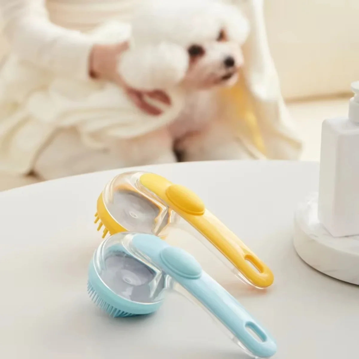 A long-handled silicone pet bathing brush for dogs and cats is shown on a white surface.