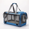 A blue breathable mesh pet carrier bag for cats and small dogs with gray straps.