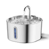 Fontaine à eau automatique en acier inoxydable avec de l'eau qui coule du bec dans la cuve.
