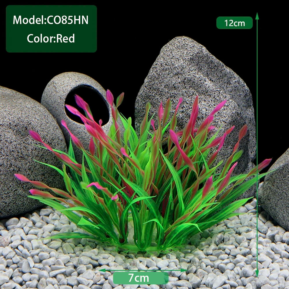 A clump of red and green artificial aquarium plants displayed in a natural stone setting.