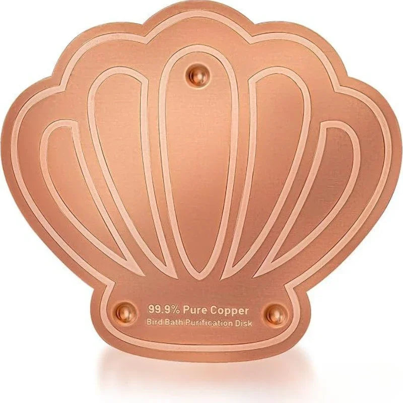 A round, copper purification disk with a scalloped edge used for bird bath cleaning.